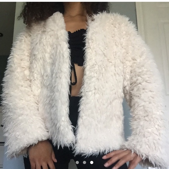 white fuzzy coat